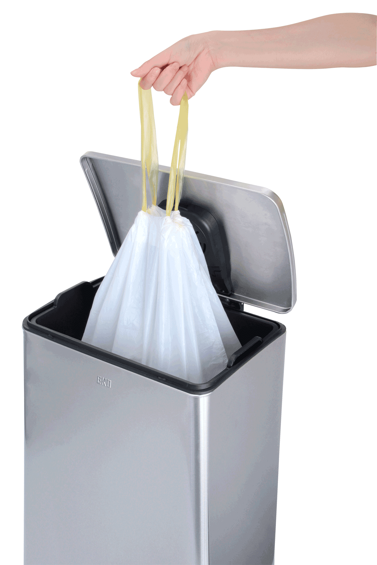 A hand holding a plastic bag in a trash can using Size F Bin Liners 40-60L, 12 bags.