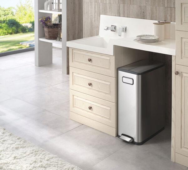 A kitchen with white cabinets and an Ecofly Kitchen Bin 30L.